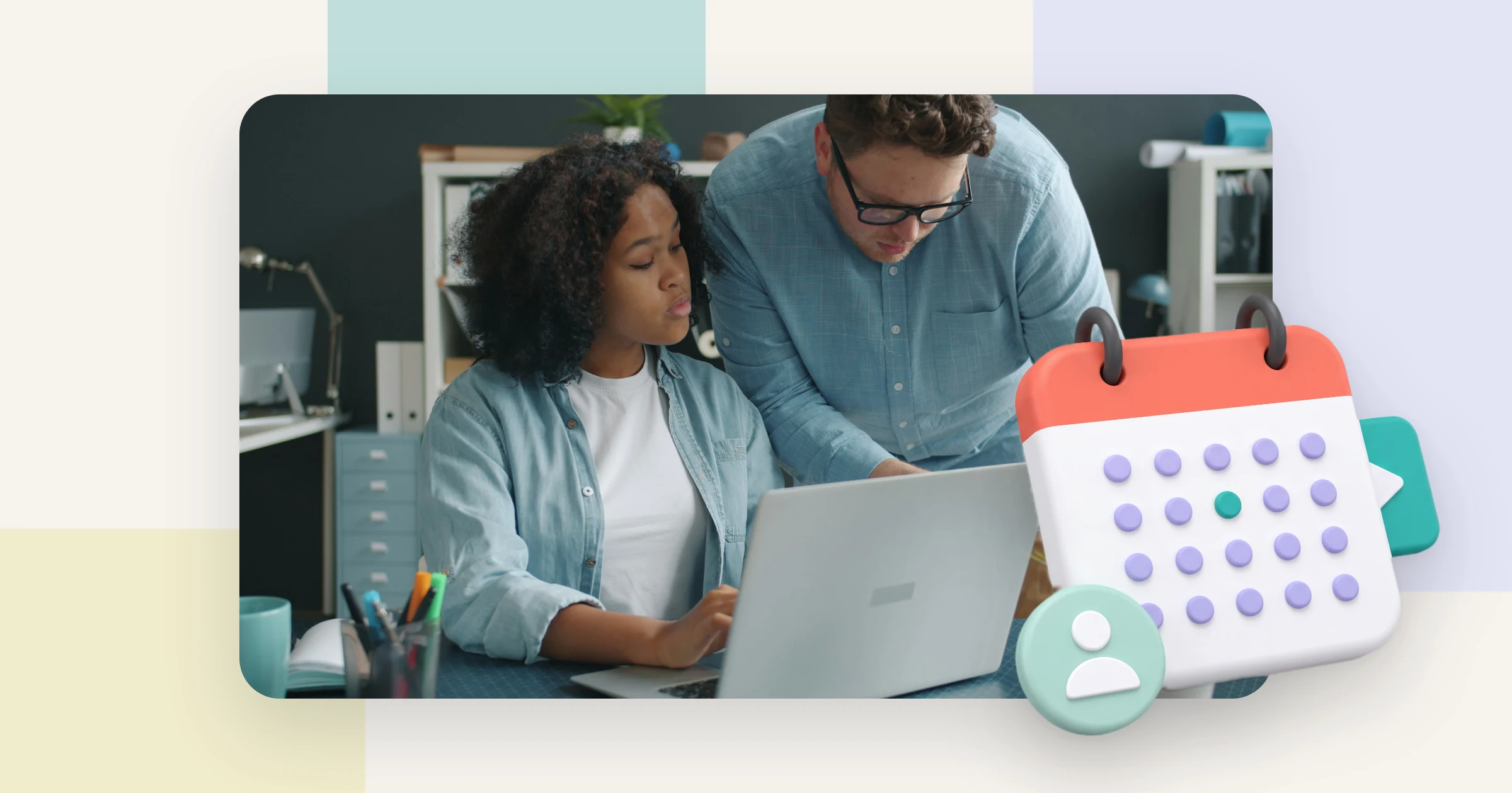 A new employee and her colleague go through employee onboarding videos together on a laptop