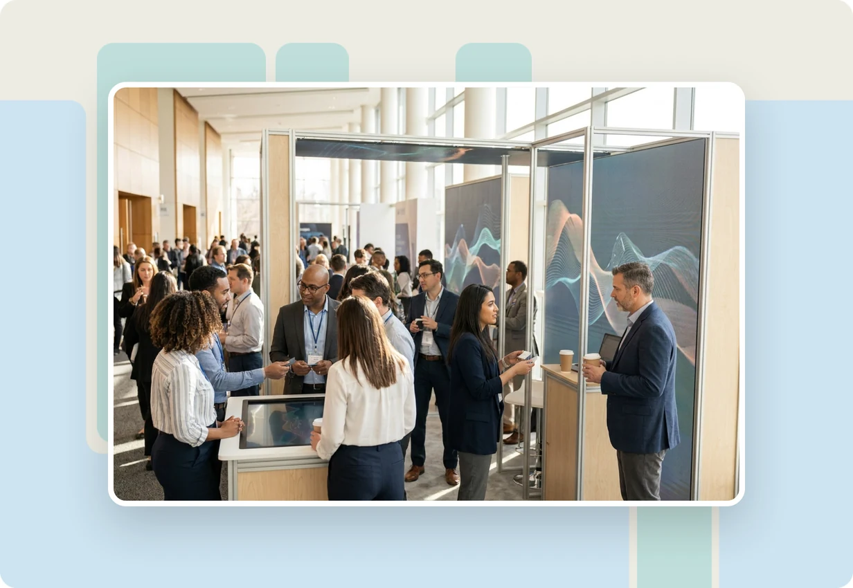 alugha at DMEXCO 2023: marketing professionals reviewing a multilingual video campaign at a digital marketing expo booth in Cologne