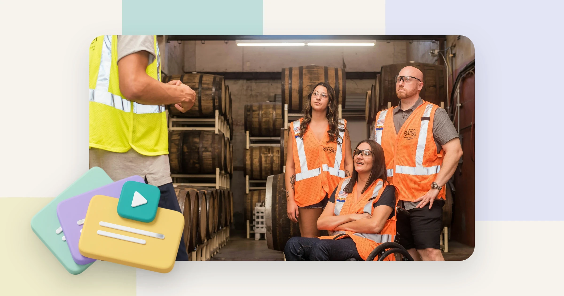 Colleagues in high-visibility vests being shown a work step, with stacked cards and a play tile, for a training video