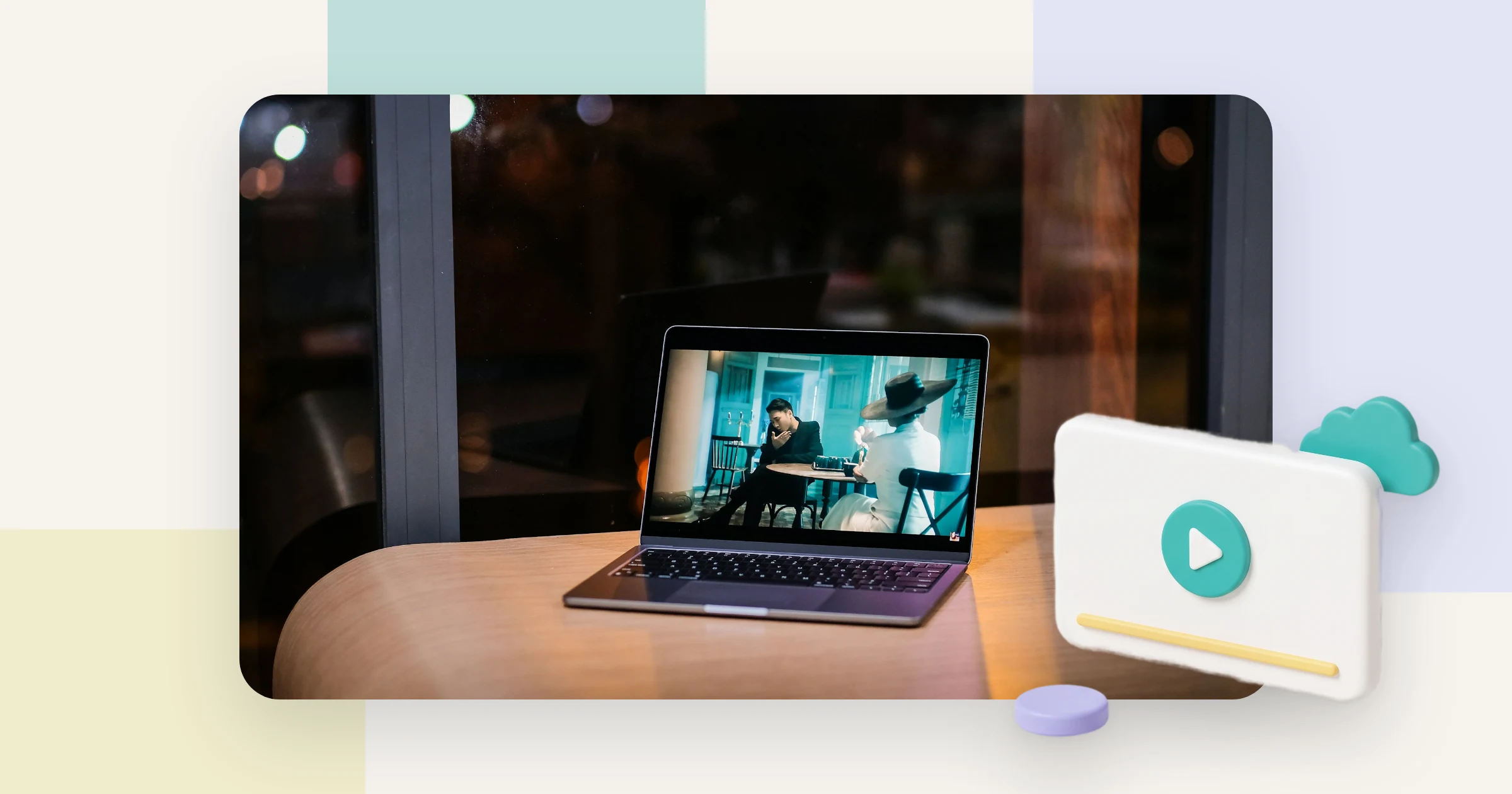 A laptop on a table in a dark room plays a video, the common case of hosting video on Google Drive