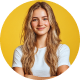 Person smiling with crossed arms, yellow background.